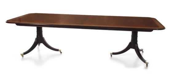 Appraisal: Baker inlaid mahogany dining table in the Sheraton taste with