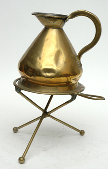 Appraisal: A TH CENTURY BRASS WINE JUG AND TRIVET Height cm