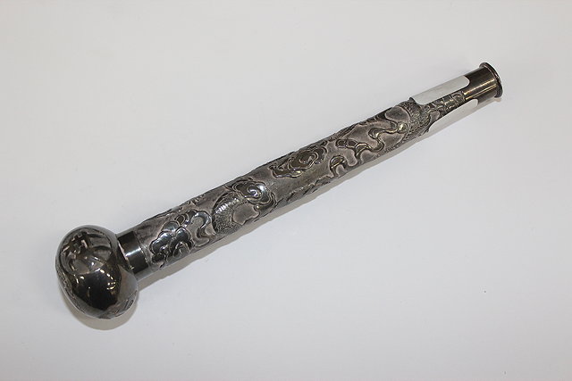 Appraisal: AN ORIENTAL WHITE METAL PARASOL HANDLE illustrated in relief with