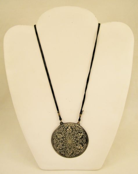 Appraisal: Sterling Overlay Medallion Asian style medallion on a black silk