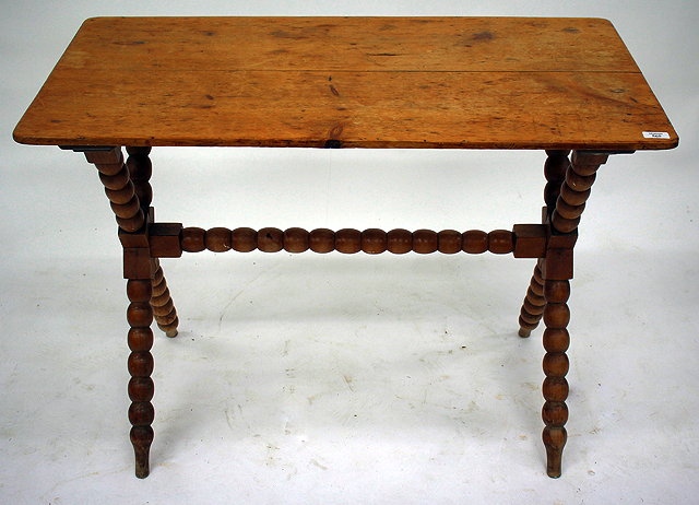 Appraisal: A TH CENTURY PINE TAVERN TYPE TABLE with bobbin turned