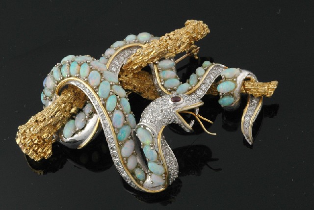 Appraisal: An opal diamond and ruby brooch The ct white and