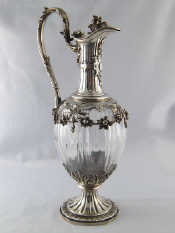 Appraisal: A French standard silver mounted claret jug the silver spread