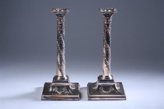 Appraisal: PAIR SHEFFIELD PLATE ADAMS-STYLE CANDLESTICKS early th century Square bases