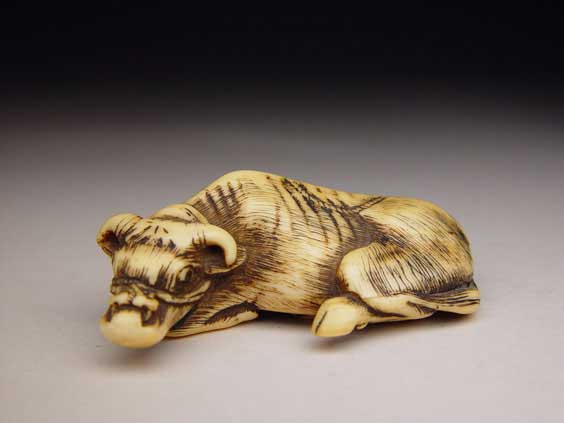 Appraisal: ANTIQUE IVORY NETSUKE Antique and well carved ivory netsuke of