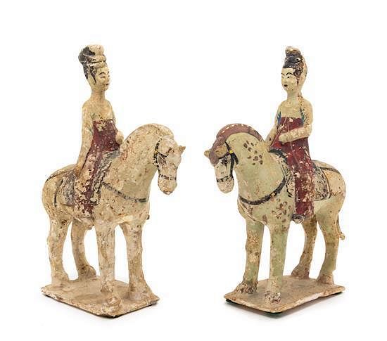 Appraisal: A Pair of Painted Pottery Figures of Equestrians Height of