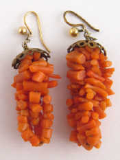 Appraisal: A pair of gilt metal coral drop earrings with gold