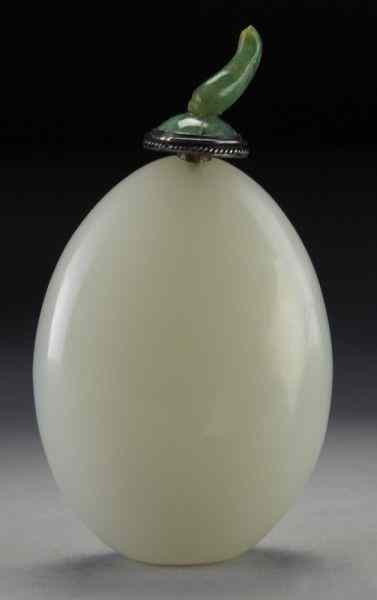 Appraisal: Chinese Qing carved pebble shaped jade snuffbottle with a jadeite