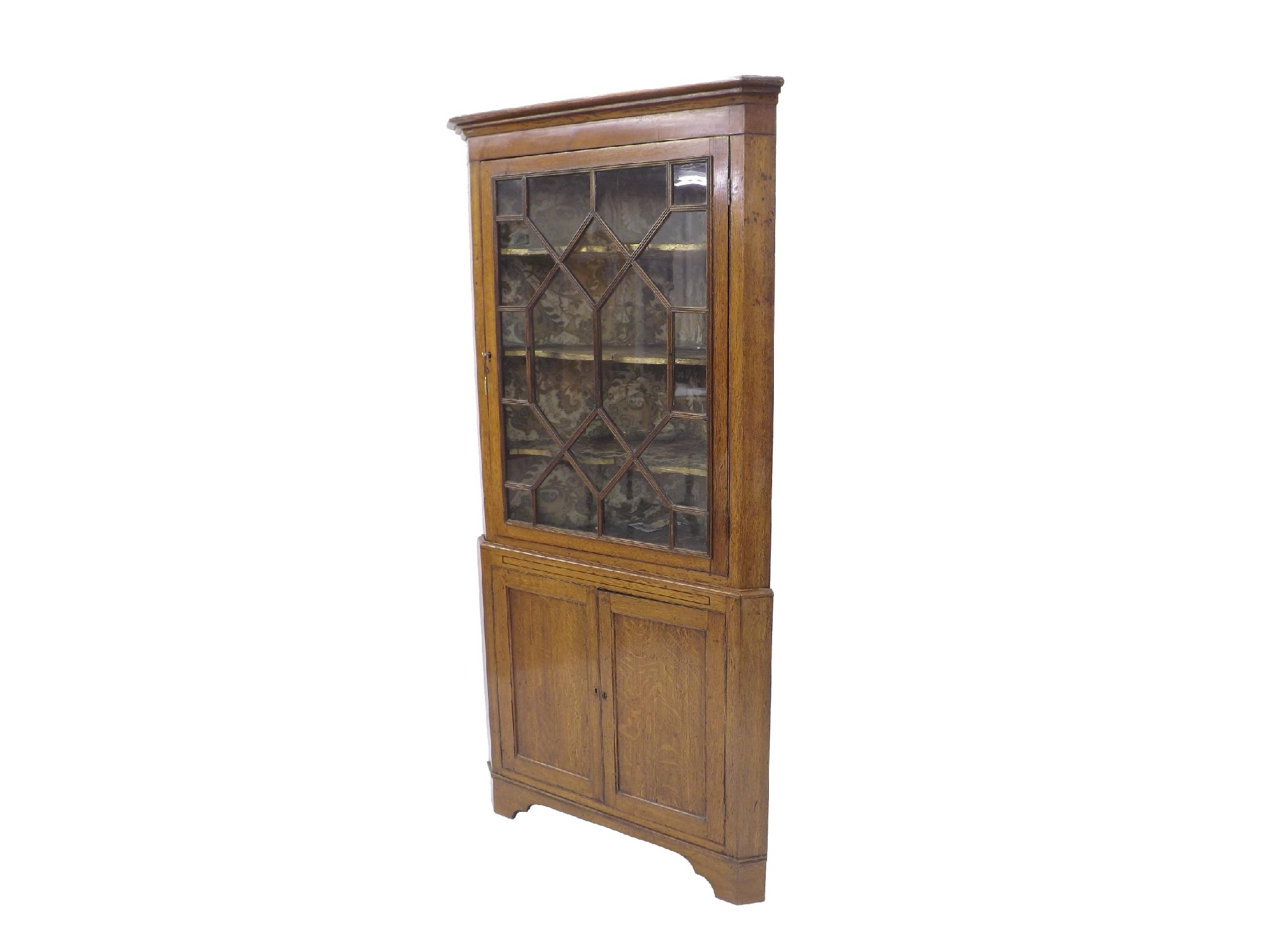 Appraisal: George III oak freestanding two tier corner cabinet the top