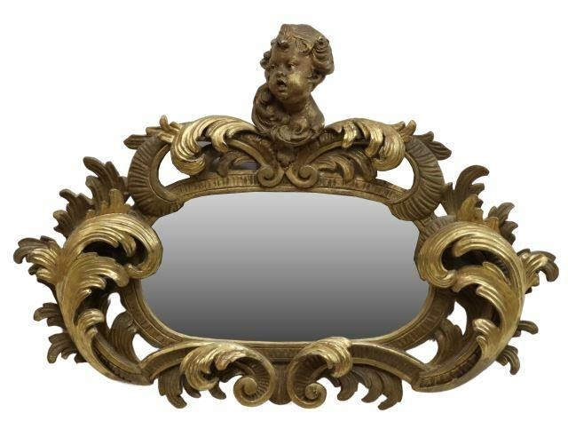 Appraisal: Continental giltwood mirror early th c scrolling foliate frame crest