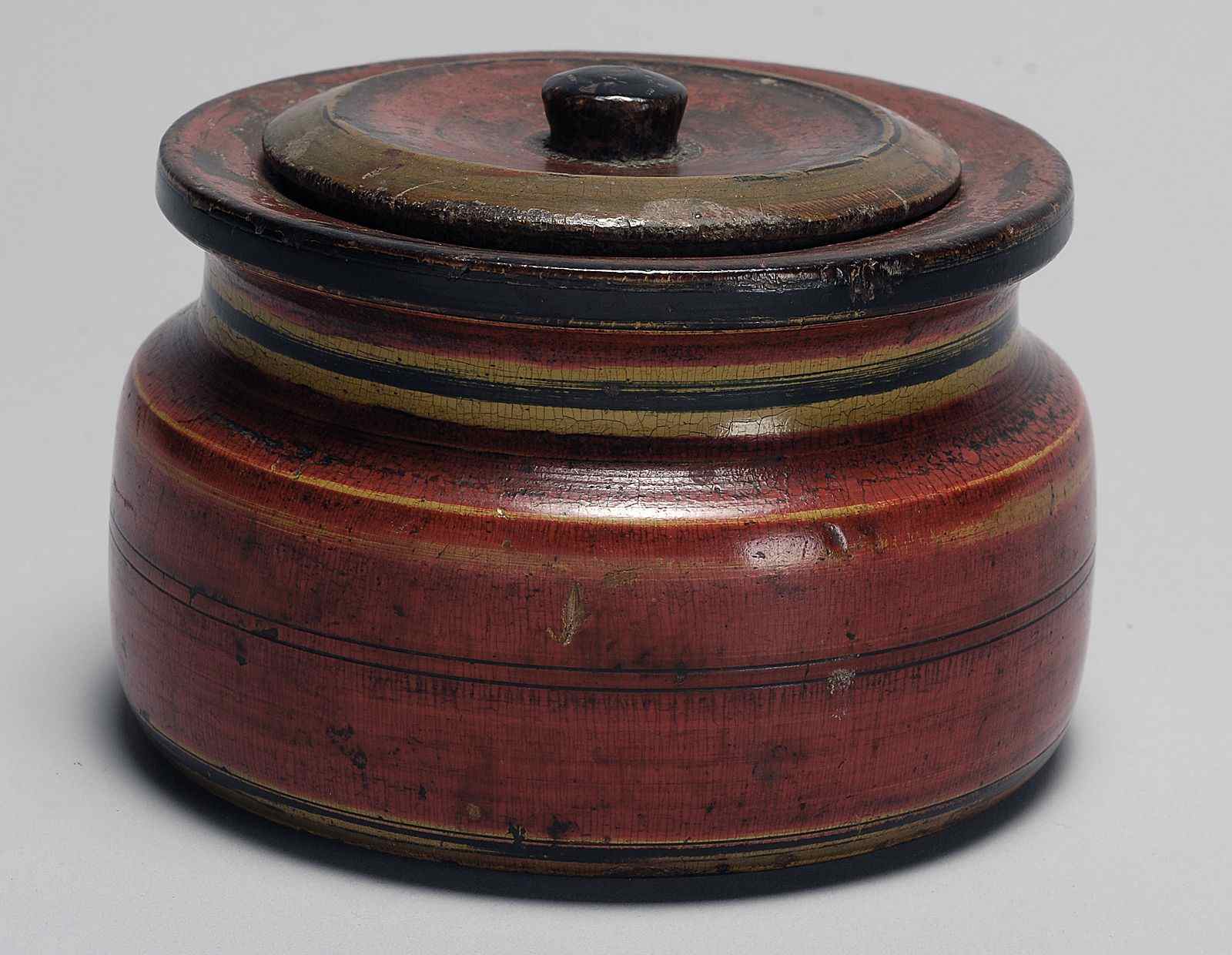 Appraisal: ANTIQUE TREENWARE COVERED TOBACCO BOXCirca In red paint with black