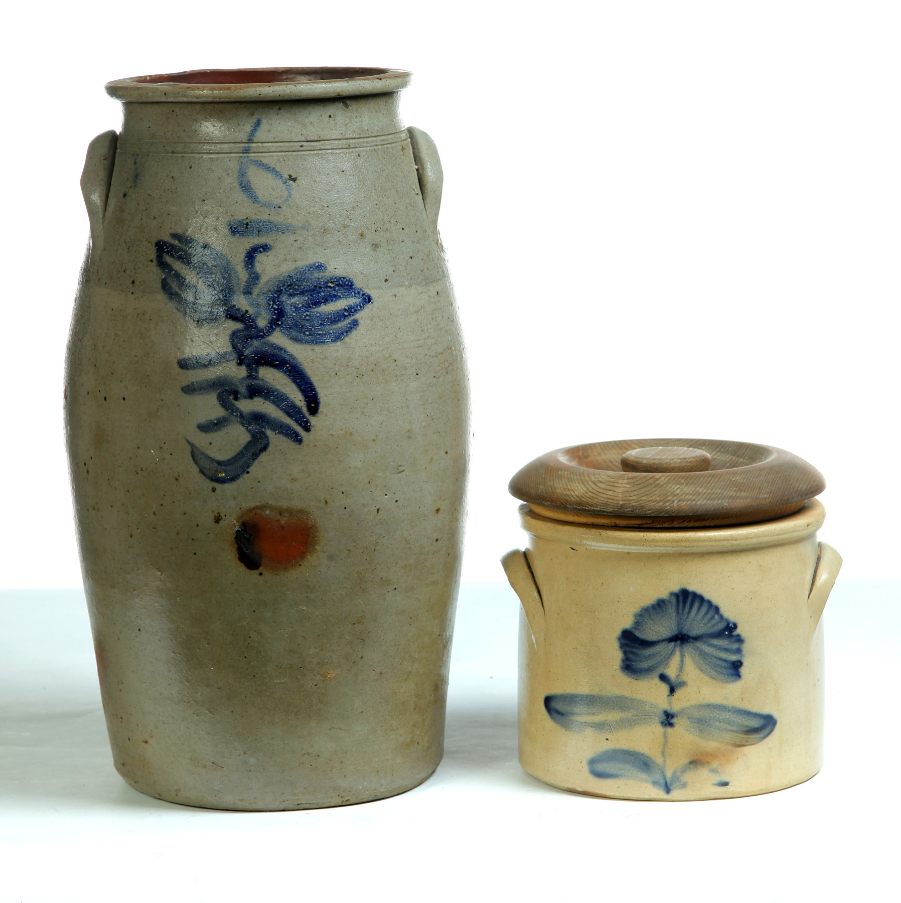 Appraisal: TWO COBALT FREEHAND DECORATED STONEWARE JARS American nd half- th