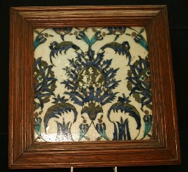 Appraisal: A framed Iznik tile in stylised leaf decoration cm square