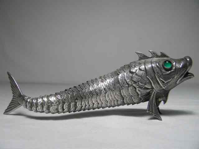 Appraisal: Sterling silver articulated fish Monogrammed Green translucent eyes Condition good