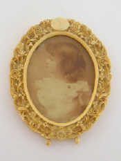 Appraisal: An ivory oval photo frame finely carved with flowers circa