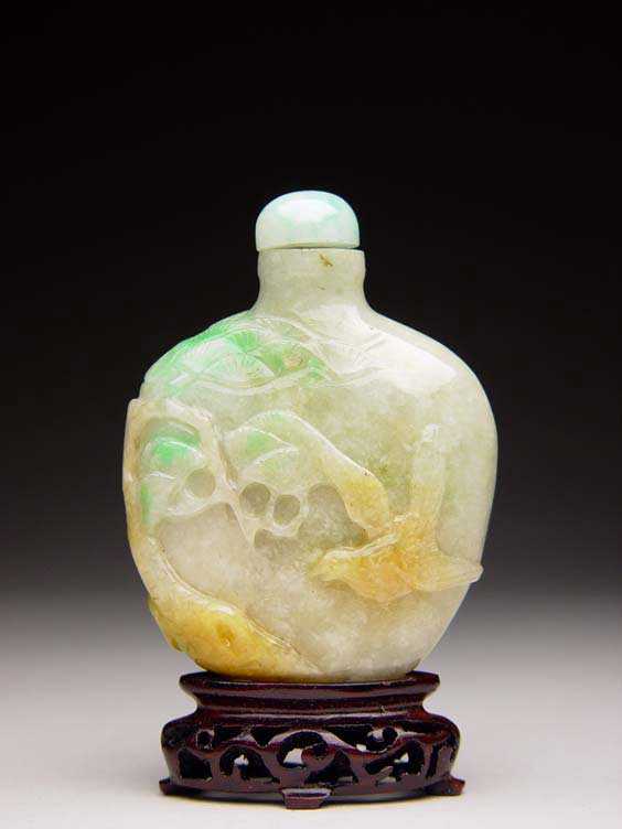 Appraisal: CARVED JADEITE SNUFF BOTTLE Carved jadeite snuff bottle of flat