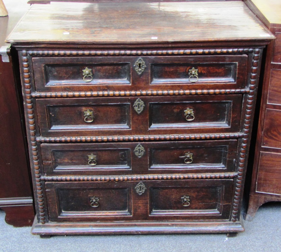 Appraisal: A late th century oak chest of four long drawers