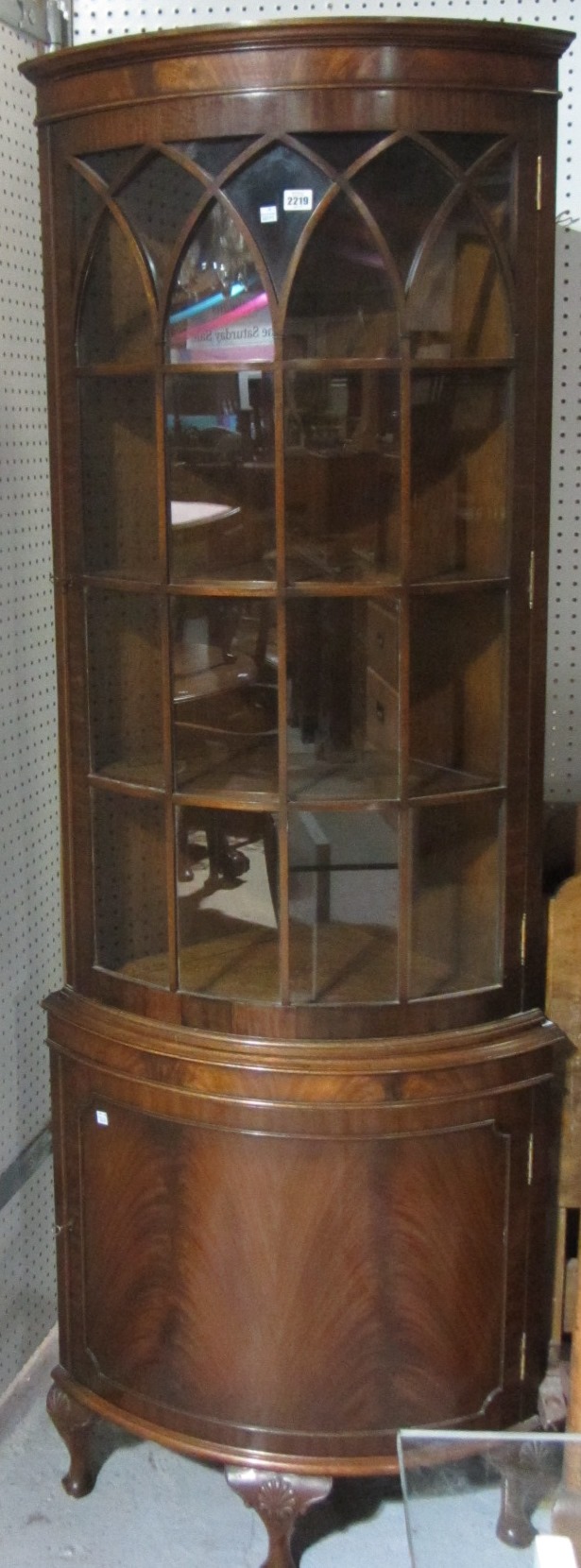 Appraisal: An th century style bowfront floor standing corner cabinet