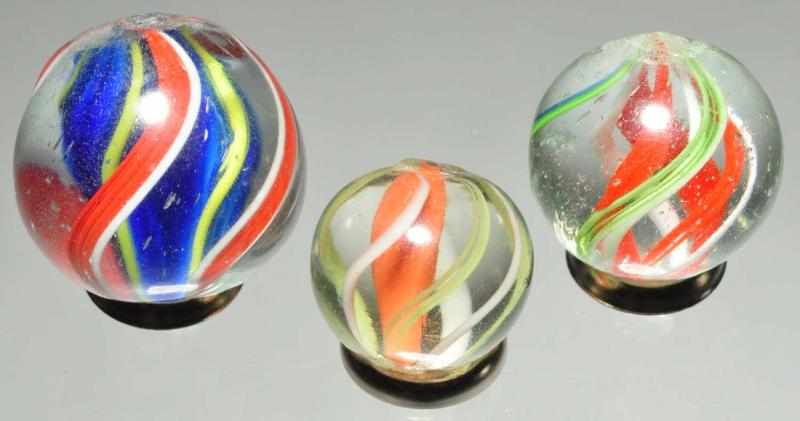 Appraisal: Lot of Swirl Marbles Description Largest is a blue solid