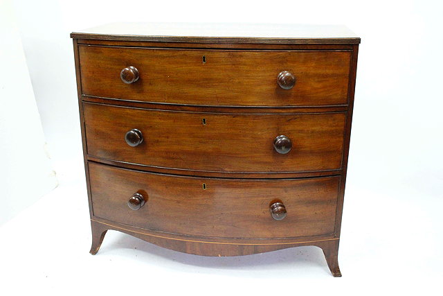 Appraisal: A TH CENTURY MAHOGANY BOW FRONTED CHEST OF THREE LONG