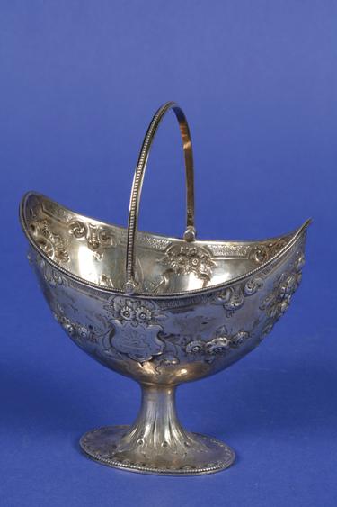 Appraisal: A VICTORIAN SWING HANDLED SUGAR BASKET of boat form with