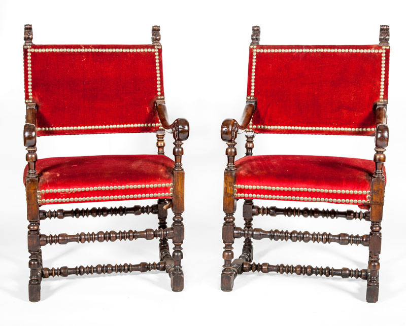 Appraisal: PAIR OF IBERIAN BAROQUE STYLE STAINED WALNUT HALL CHAIRS Upholstered