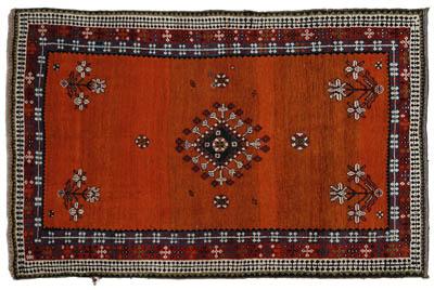 Appraisal: Hand woven Karaghasli Shiraz rug repeating floral designs on varying