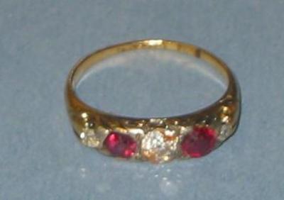 Appraisal: A RUBY AND DIAMOND RING comprising five graduated alternating stones