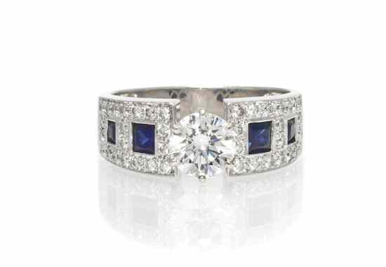 Appraisal: A Platinum Diamond and Sapphire Ring containing one round brilliant