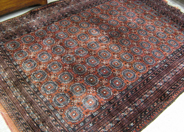 Appraisal: SILK TURKOMAN TRIBAL CARPET repeating Turkoman gols arranged in seven