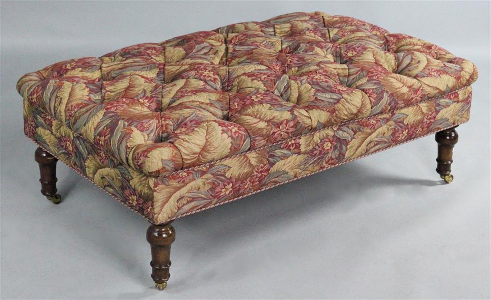 Appraisal: LARGE TUFTED OTTOMAN ON TURNED MAHOGANY LEGS tapestry design upholstery