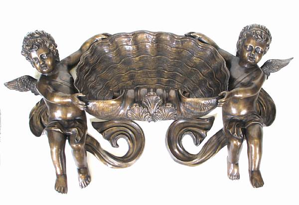 Appraisal: A Rococo style patinated bronze wall fountain with cherubs height