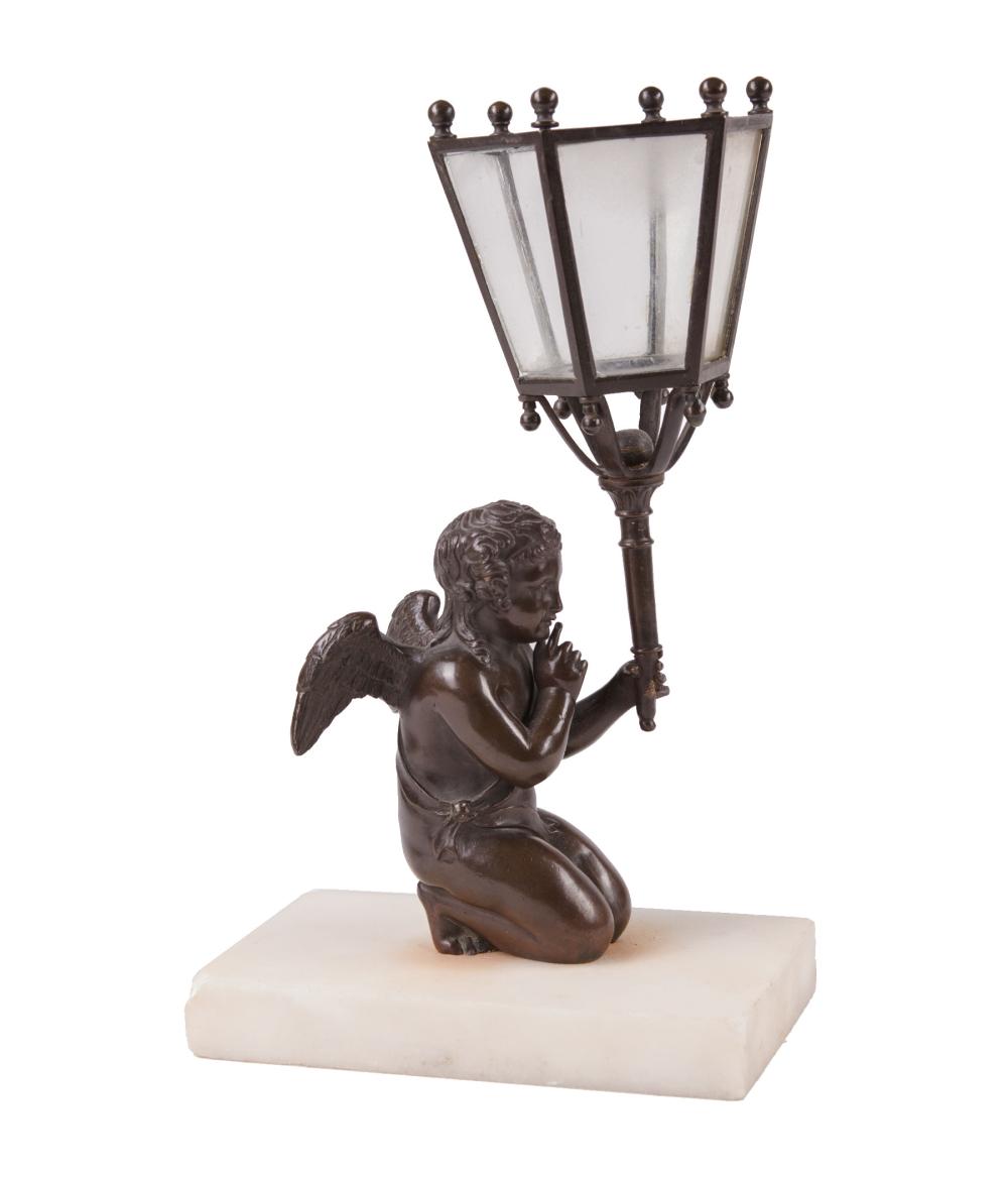 Appraisal: Continental Patinated Bronze and Glass Figural Candleholder modeled as kneeling