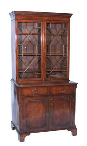 Appraisal: A CHIPPENDALE STYLE MAHOGANY BOOKCASE the astragal glazed top and