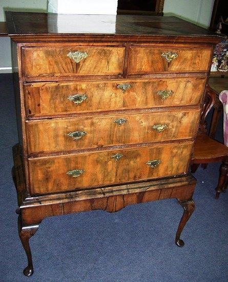 Appraisal: An th Century walnut chest on stand the upper section