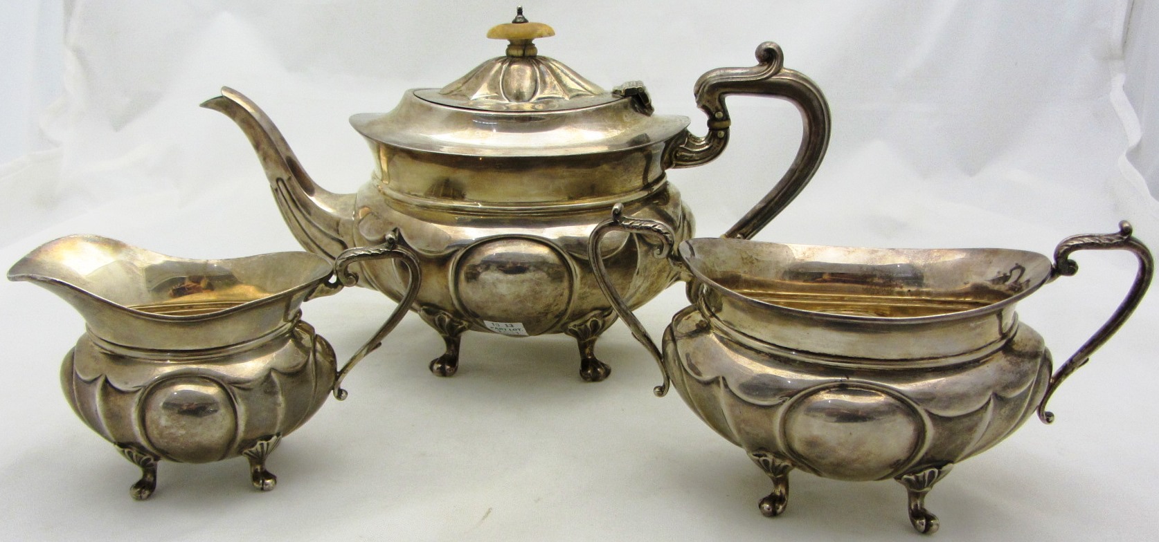 Appraisal: A silver three piece tea set comprising a teapot a