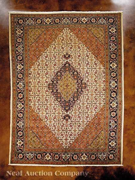 Appraisal: A Persian Tabriz Carpet repeating central field diamonds in cream