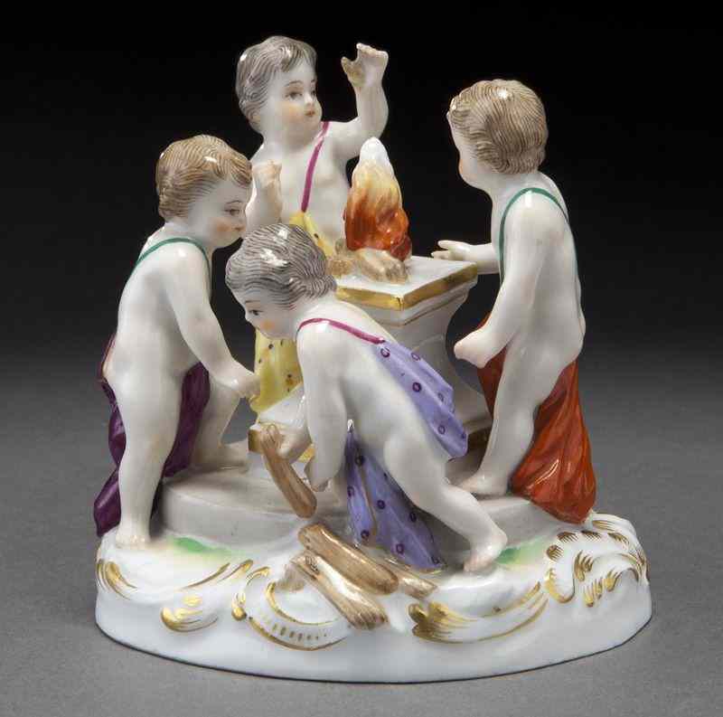 Appraisal: Meissen porcelain figural group of four puttiaround a fire burning