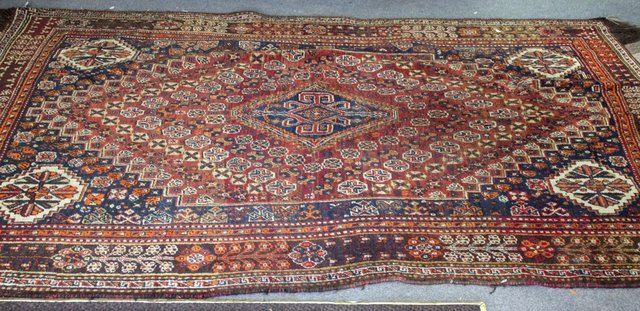 Appraisal: An Oriental rug central indigo and madder medallion within indigo