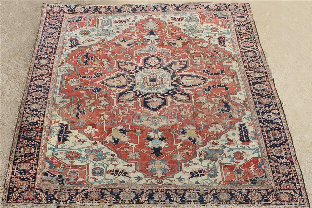 Appraisal: PERSIAN MEDALLION SERAPI WOOL RUG central medallion on a rust