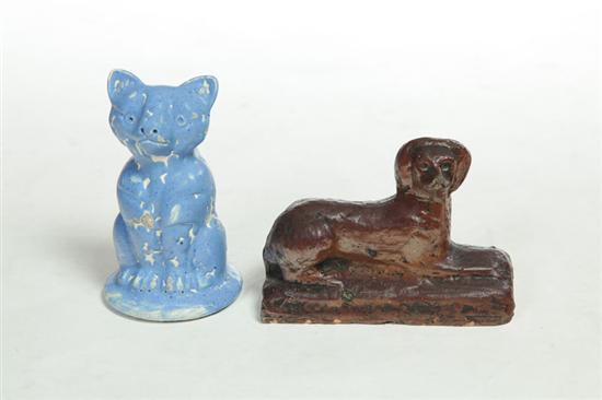 Appraisal: POTTERY DOG AND CAT Ohio th century Sewertile reclining dog