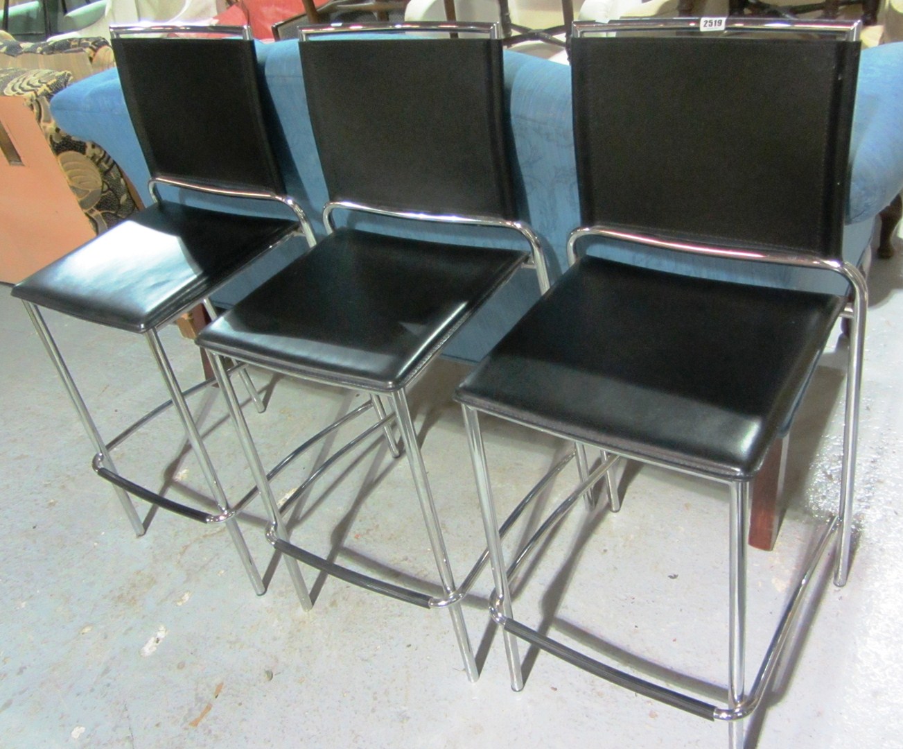 Appraisal: A set of three th century chrome and leather chairs