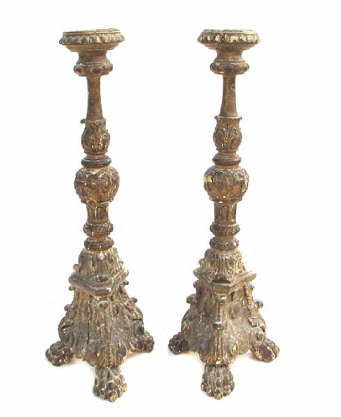 Appraisal: A pair of Italian Baroque style giltwood candlesticks th century