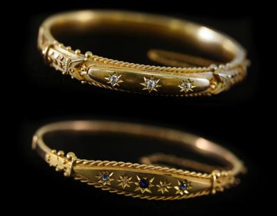 Appraisal: A ct yellow gold hinged bangle circa set with three