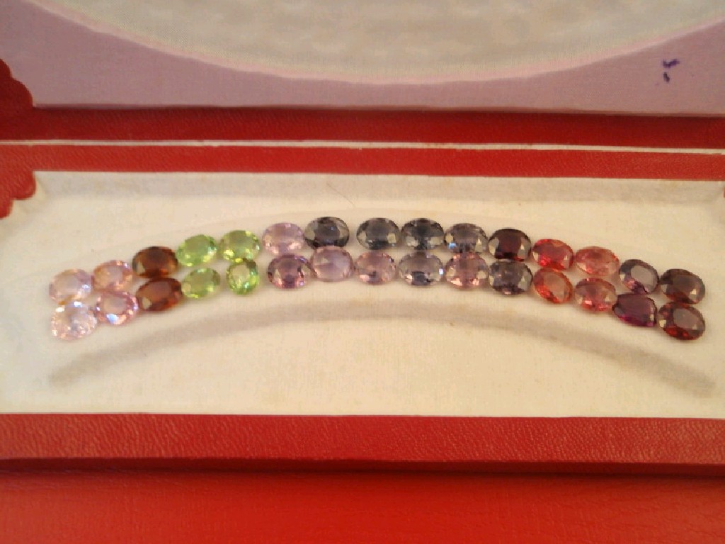 Appraisal: A case containing various coloured loose spinels