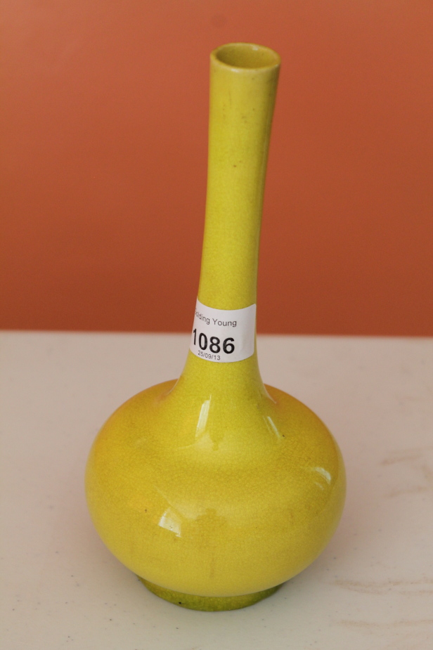 Appraisal: A Chinese monochrome yellow bottle vase cm high