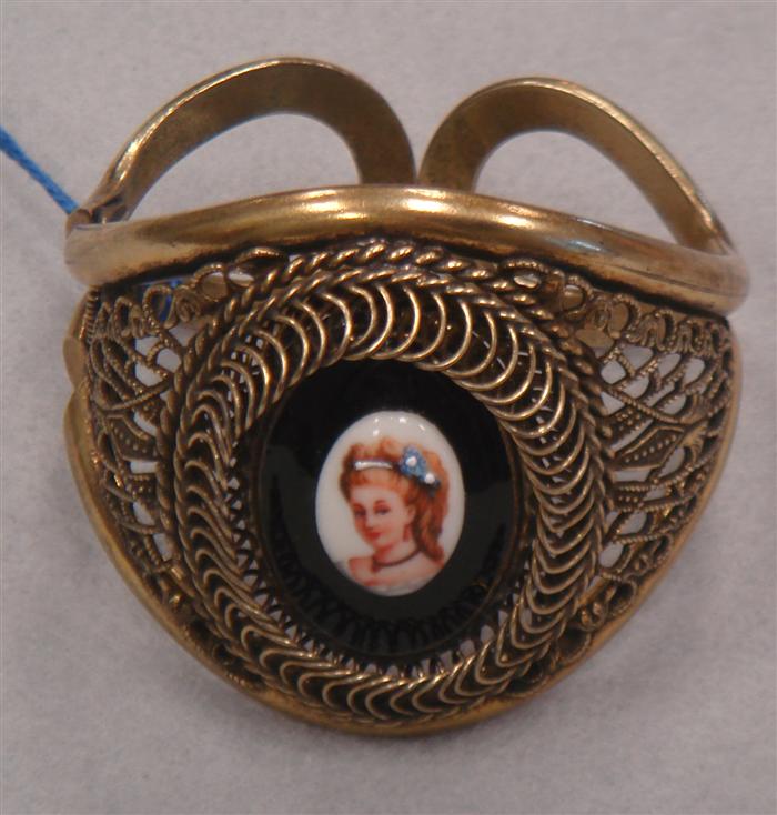 Appraisal: Wide hinged cuff marked 'Warner' featuring hand painted porcelain portrait