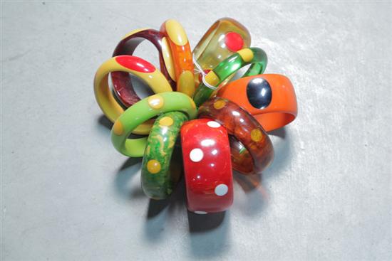 Appraisal: TEN BAKELITE BRACELETS All with inlaid dots Various colors Eight