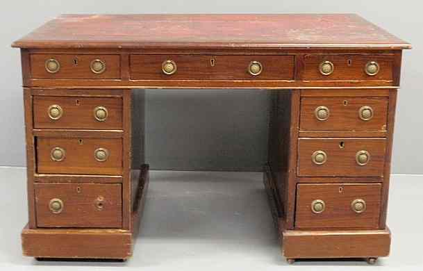 Appraisal: English Regency mahogany knee-hole desk with a red leather top