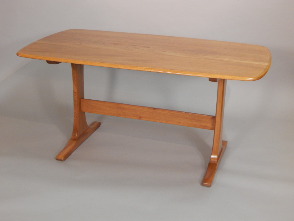 Appraisal: An Ercol light elm retro style dining table the rectangular